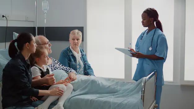 Doctor consulting with family member